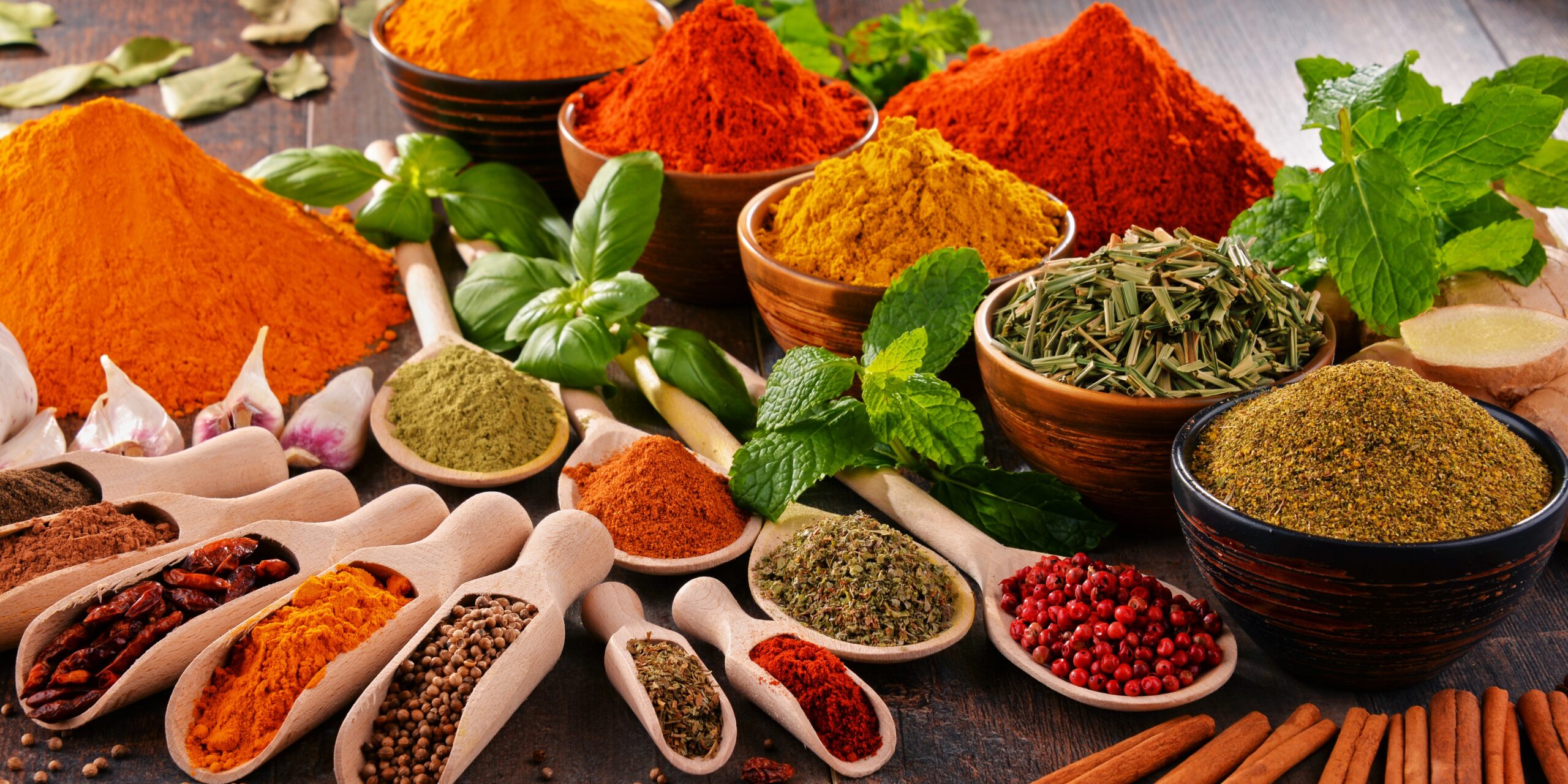 Variety of spices on kitchen table.