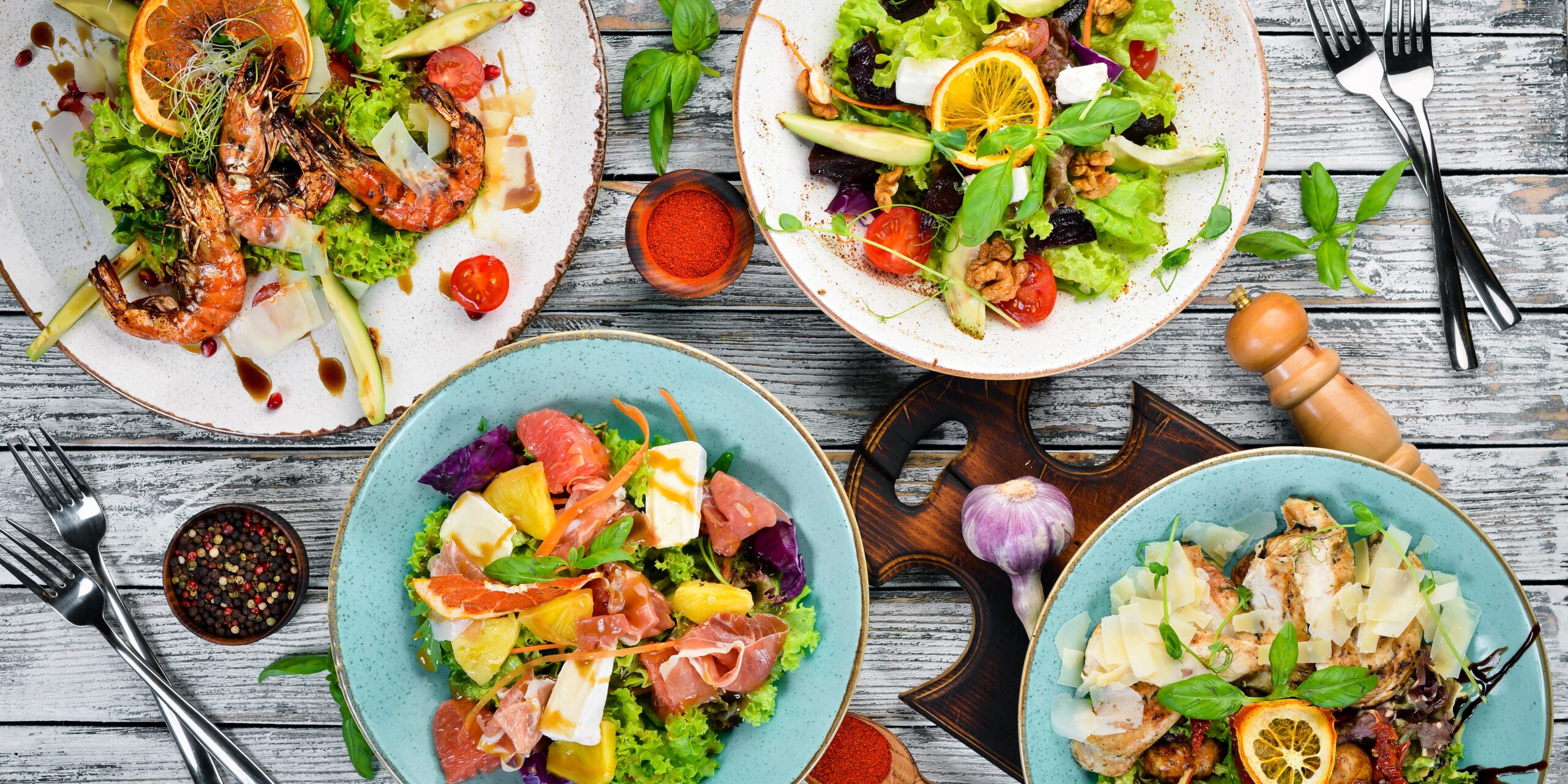 A set of salads. In the plate. Rustic style. Top view. Free space for your text.